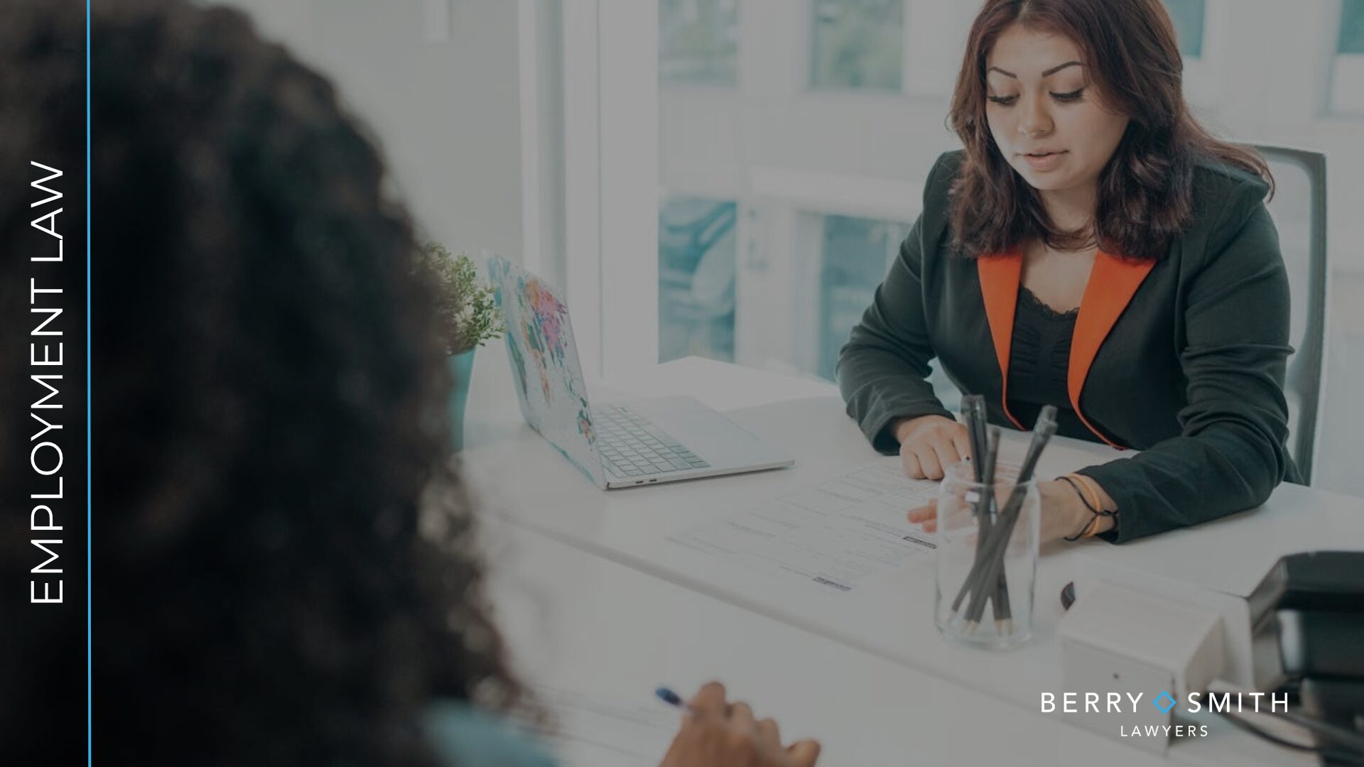 Employee discussing a settlement agreement with an adviser before signing.